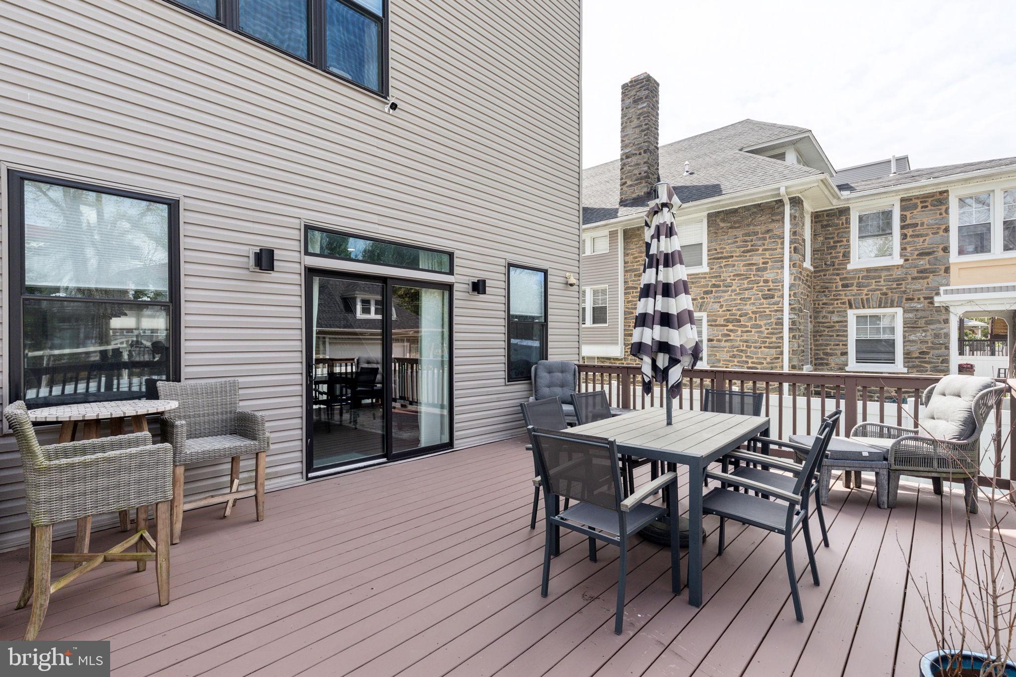 5301 Gainor Road Philadelphia, PA 19131 - Photo 14 of 51 a view of a dinning table and chairs in patio of the house