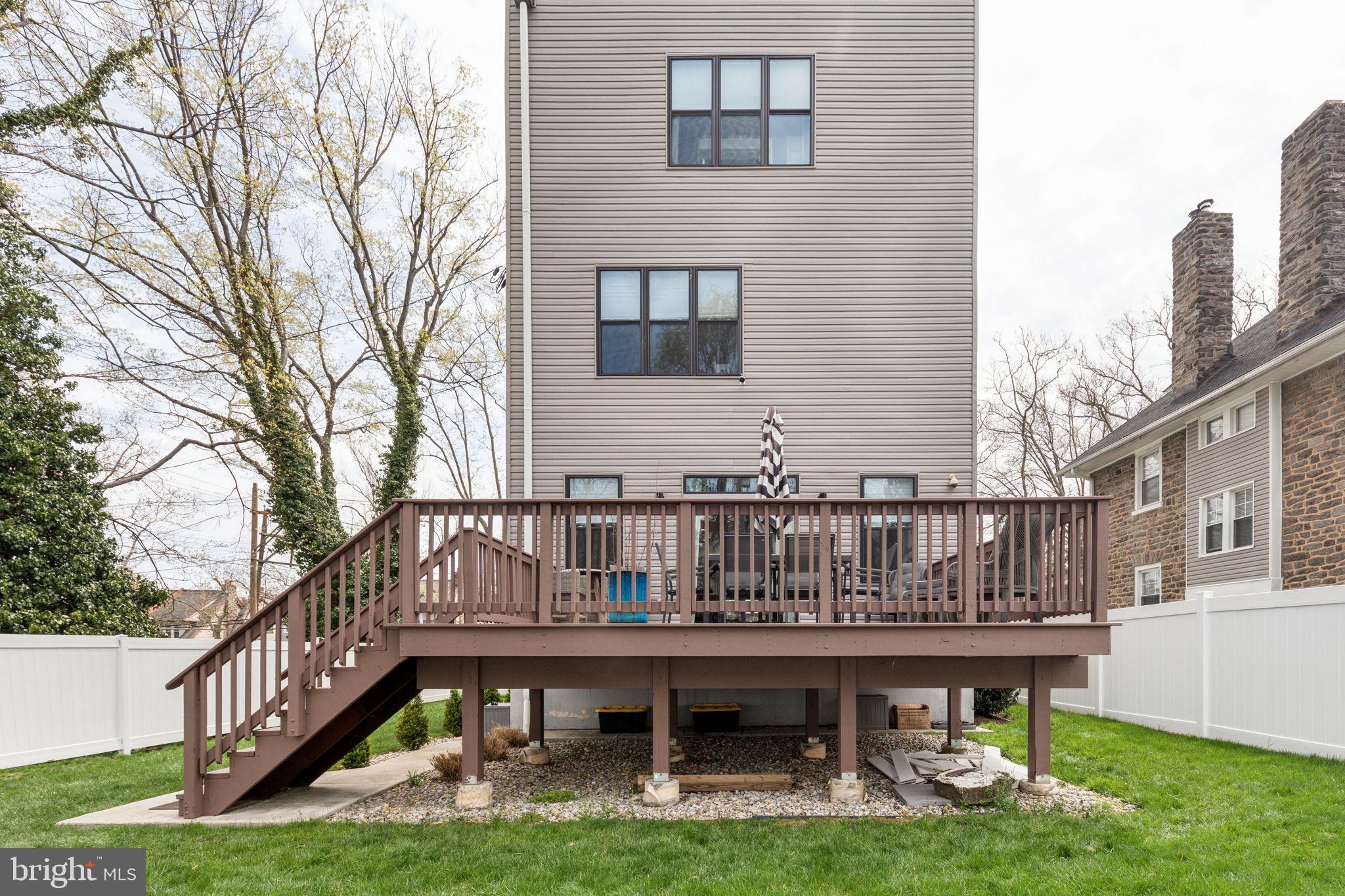 5301 Gainor Road Philadelphia, PA 19131 - Photo 15 of 51 a view of a house with backyard and deck