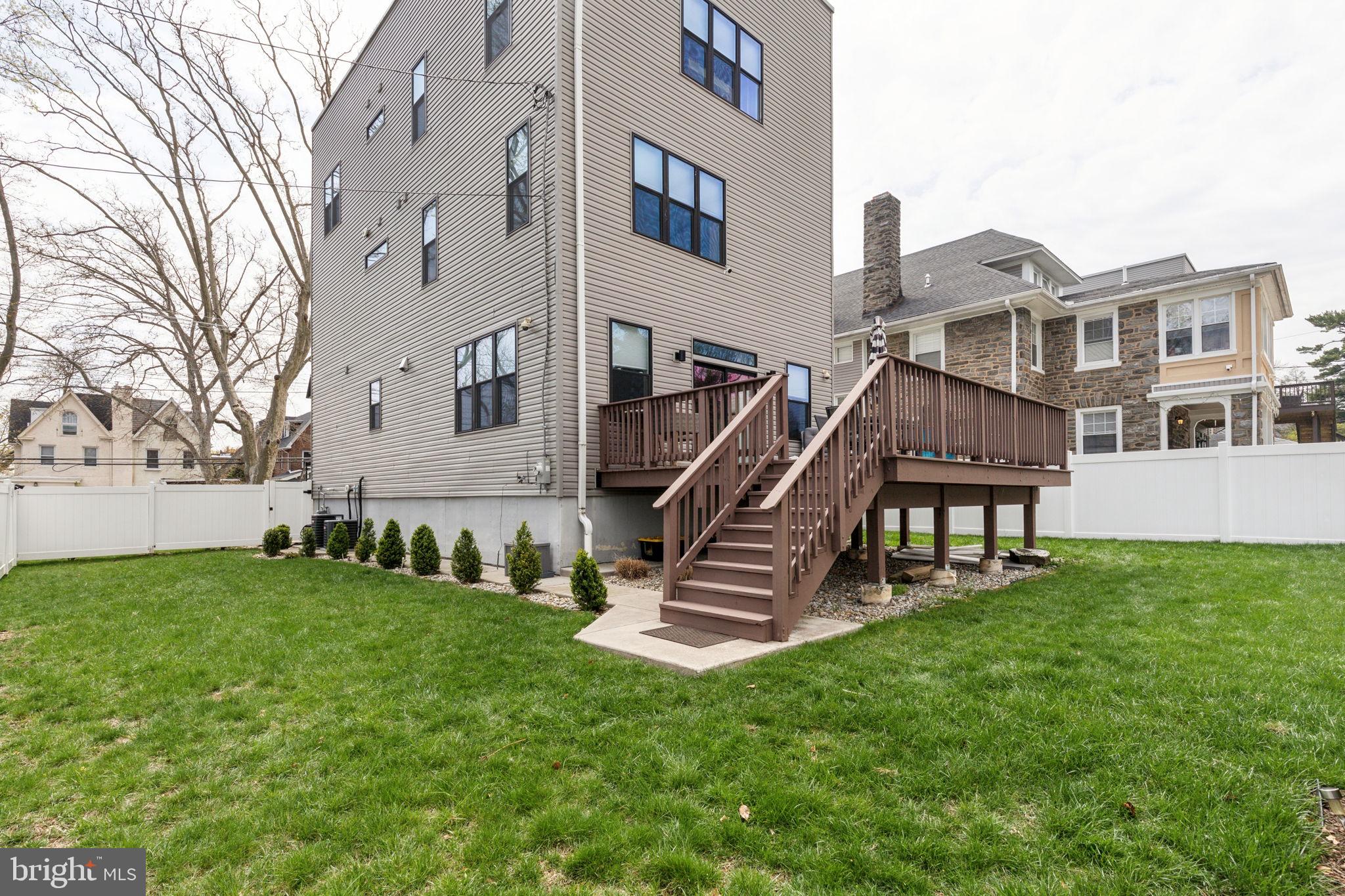 5301 Gainor Road Philadelphia, PA 19131 - Photo 16 of 51 a front view of a house with a yard