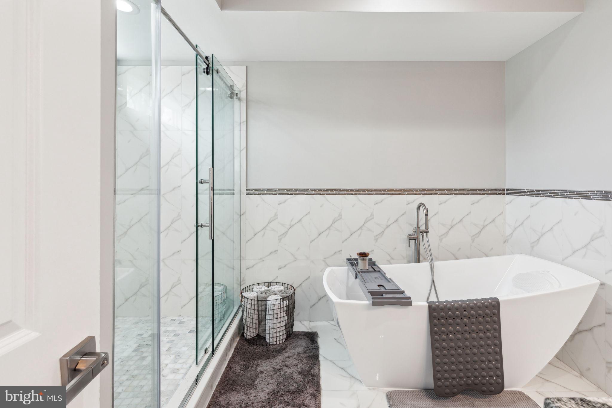 5301 Gainor Road Philadelphia, PA 19131 - Photo 25 of 51 a bathroom with a bathtub and shower