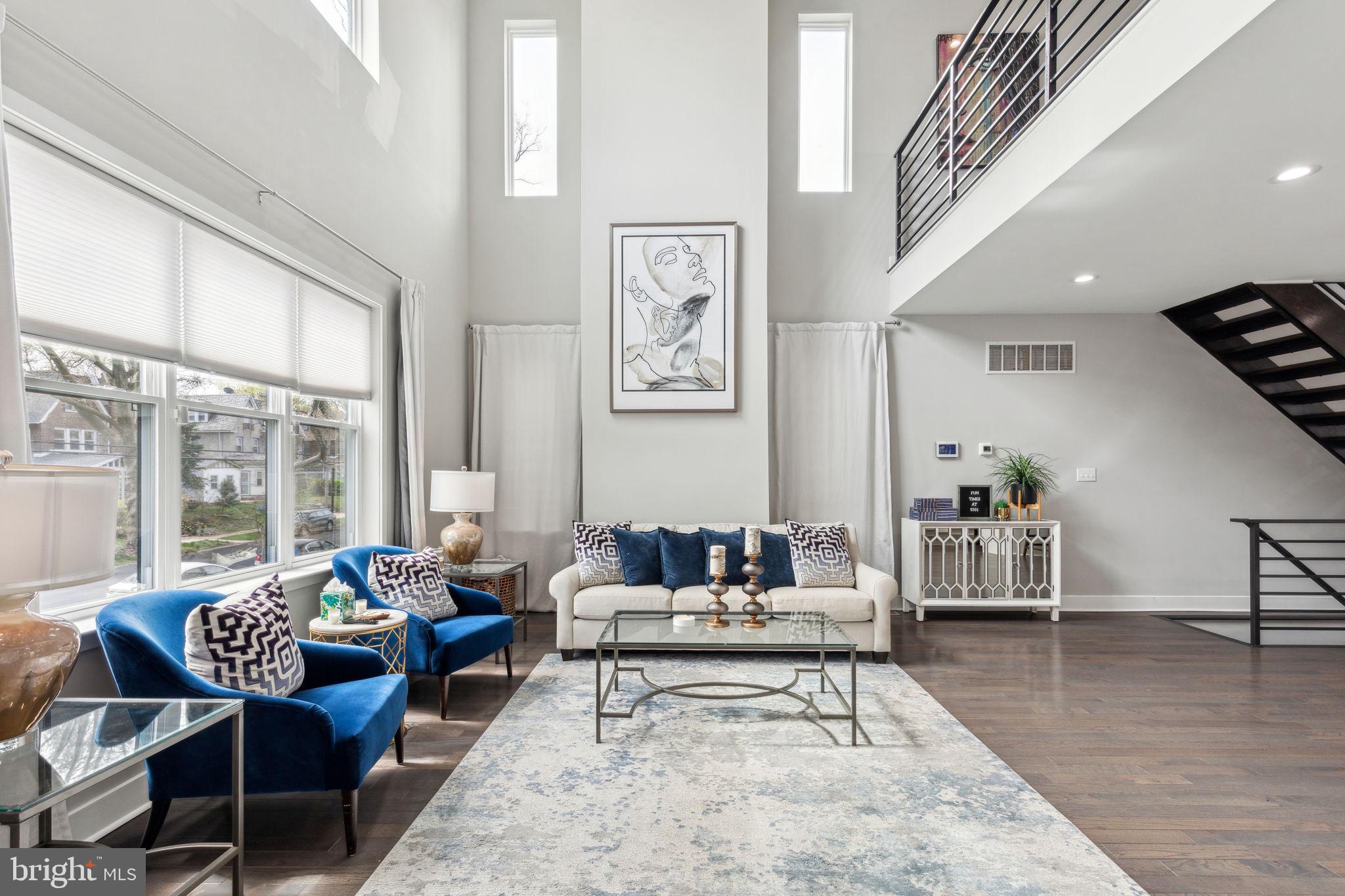 5301 Gainor Road Philadelphia, PA 19131 - Photo 3 of 51 a living room with furniture and a wooden floor
