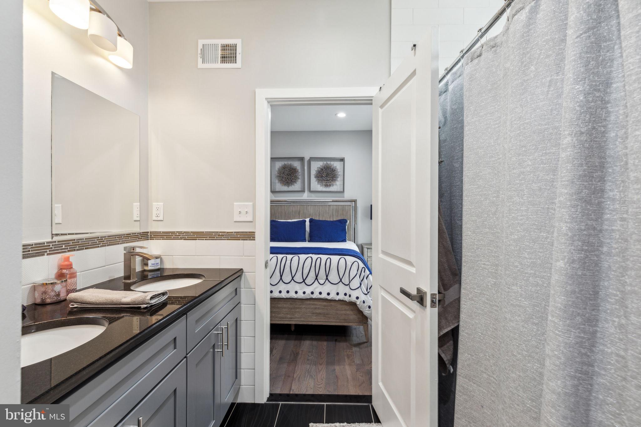 5301 Gainor Road Philadelphia, PA 19131 - Photo 34 of 51 a kitchen with a sink and a stove top oven