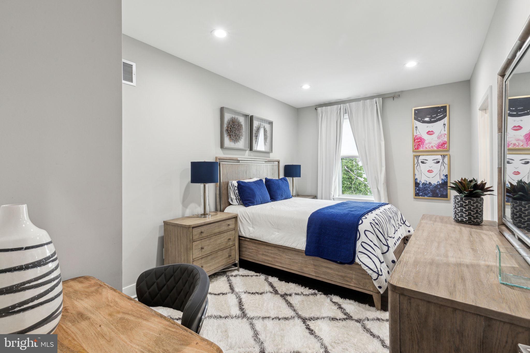 5301 Gainor Road Philadelphia, PA 19131 - Photo 36 of 51 a bedroom with a bed and a couch