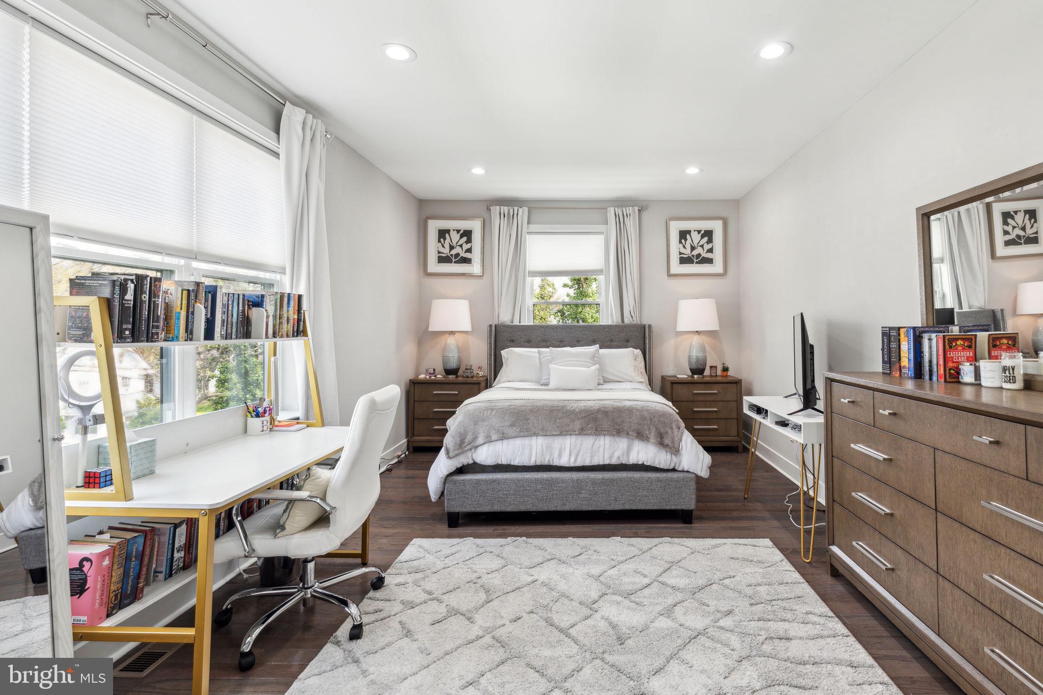 5301 Gainor Road Philadelphia, PA 19131 - Photo 40 of 51 a bedroom with a bed and a book shelf