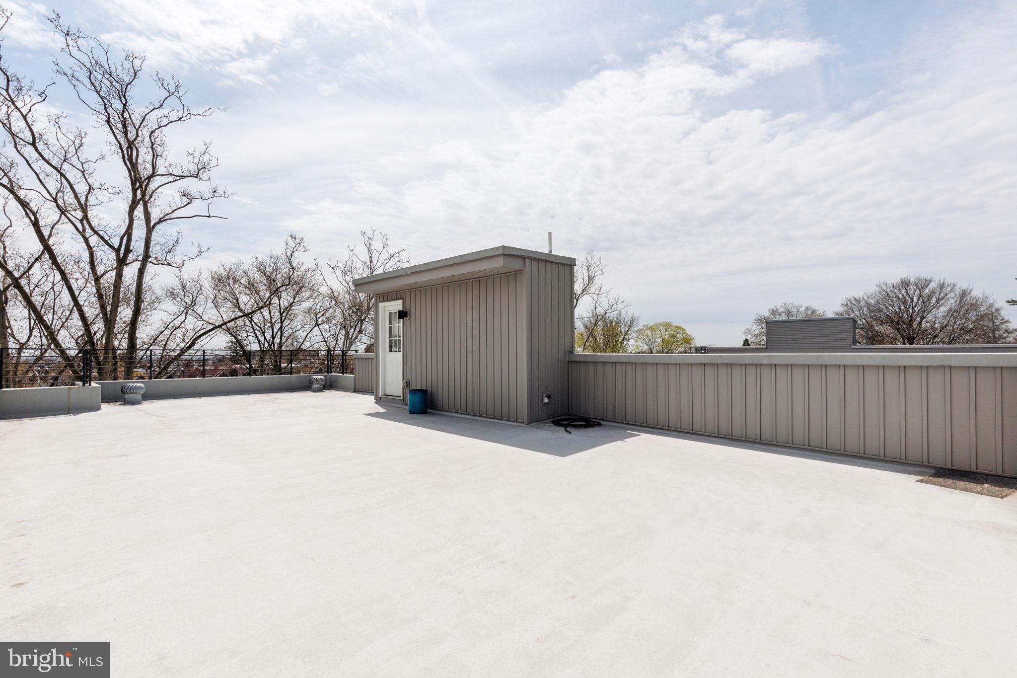 5301 Gainor Road Philadelphia, PA 19131 - Photo 44 of 51 a view of roof and covered with wooden fence