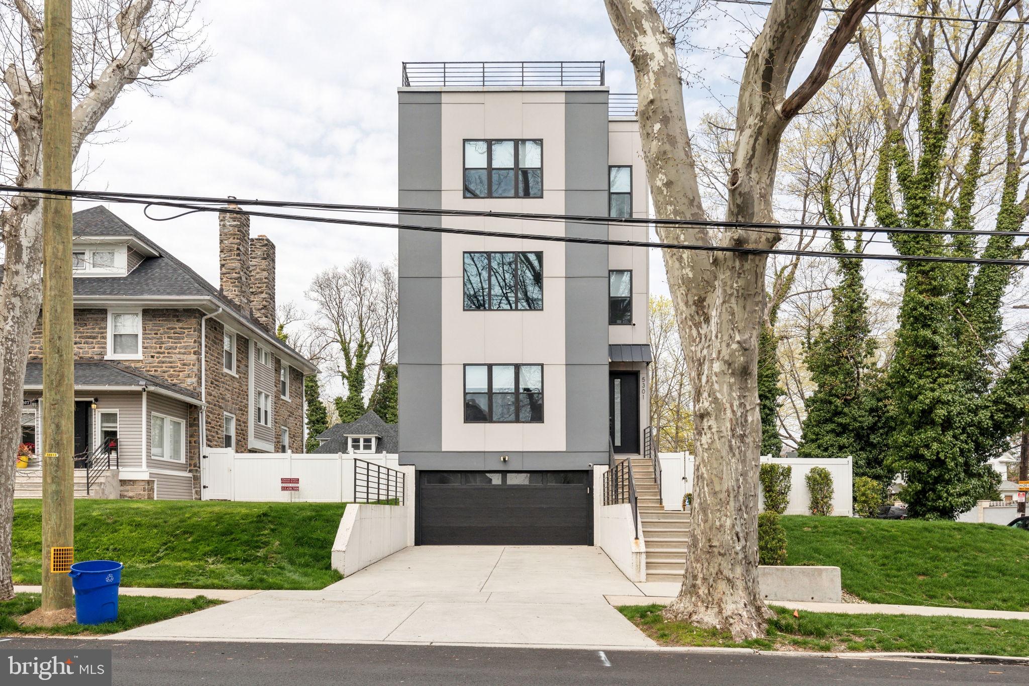 5301 Gainor Road Philadelphia, PA 19131 - Photo 49 of 51 a front view of a house with a yard