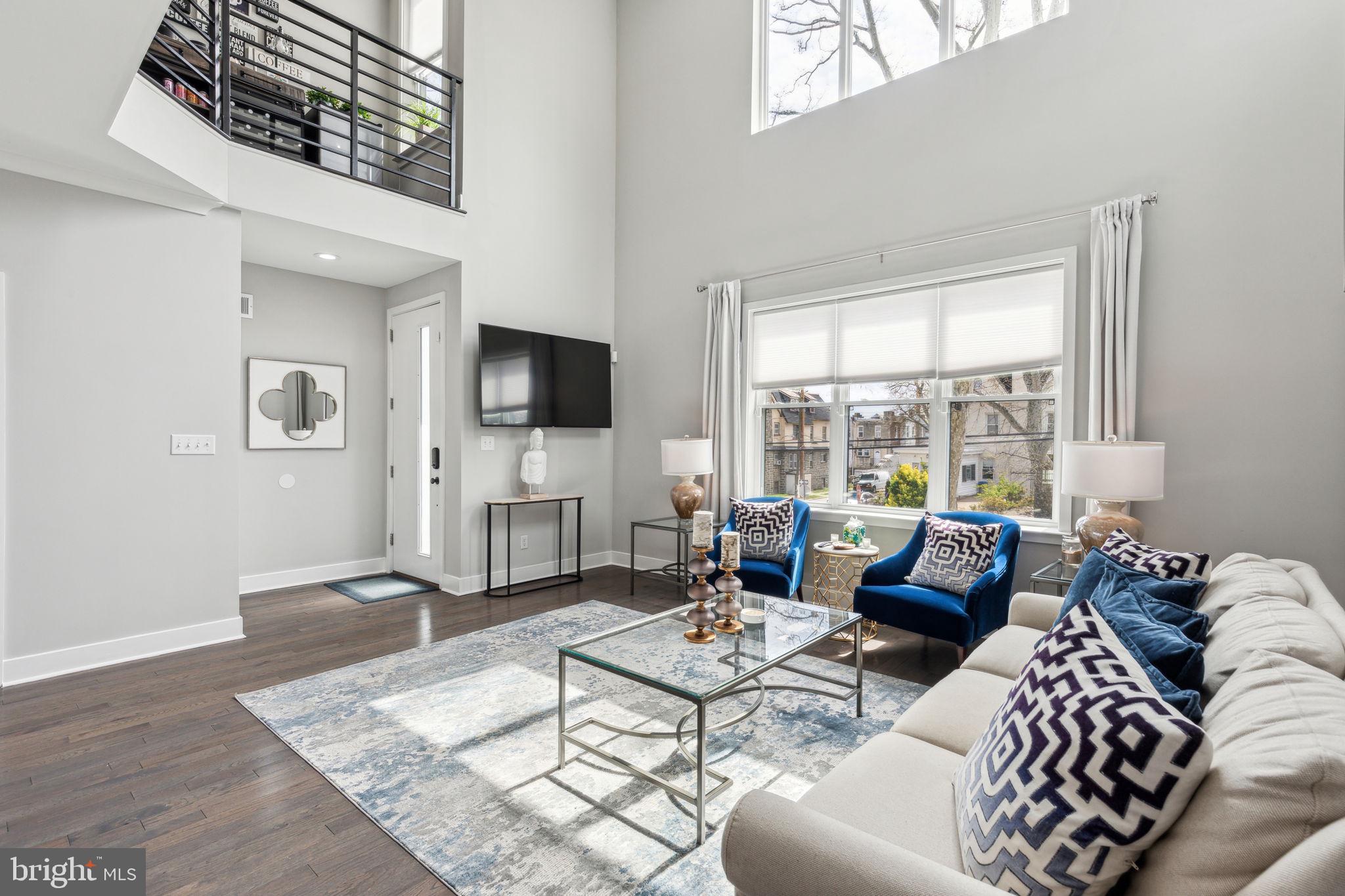 5301 Gainor Road Philadelphia, PA 19131 - Photo 5 of 51 a living room with furniture and a flat screen tv