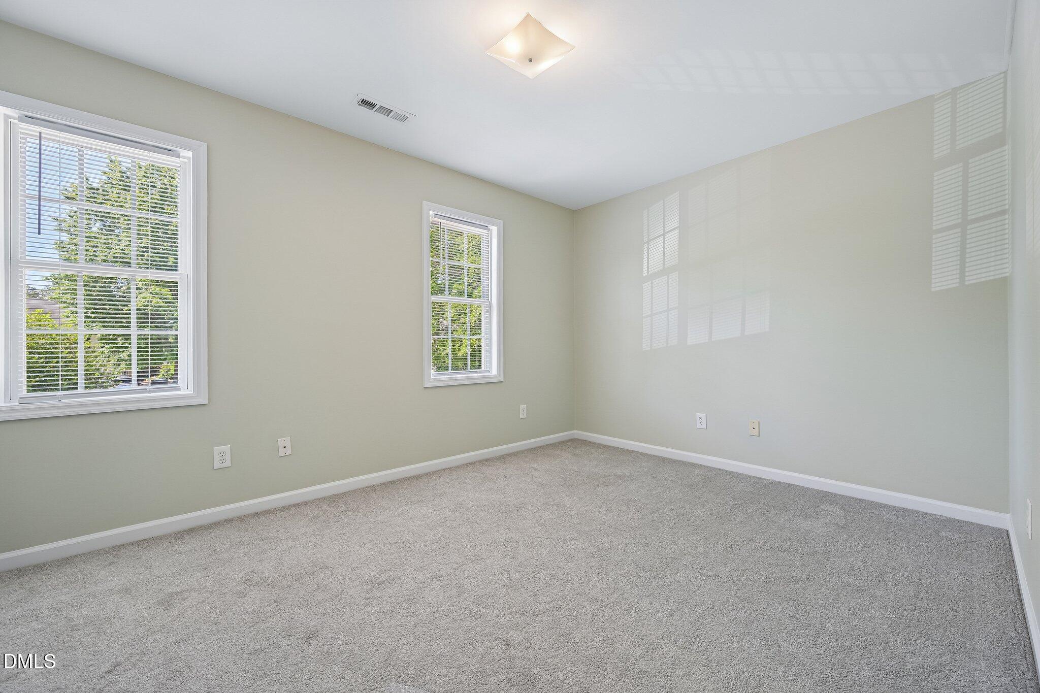 278 South Raleigh Street Angier, NC 27501 - Photo 5 of 35 an empty room with a window