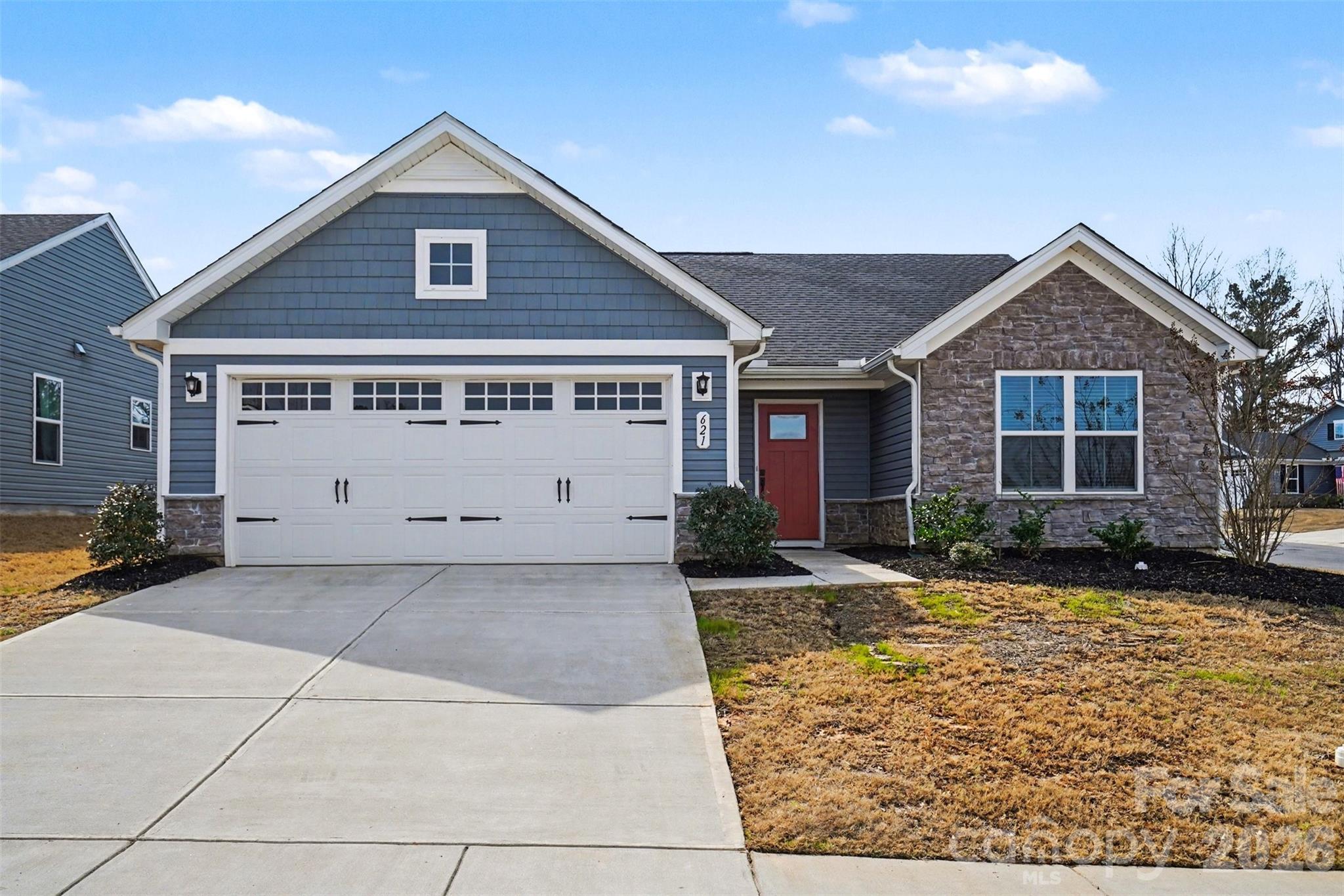 a view of a house with a yard