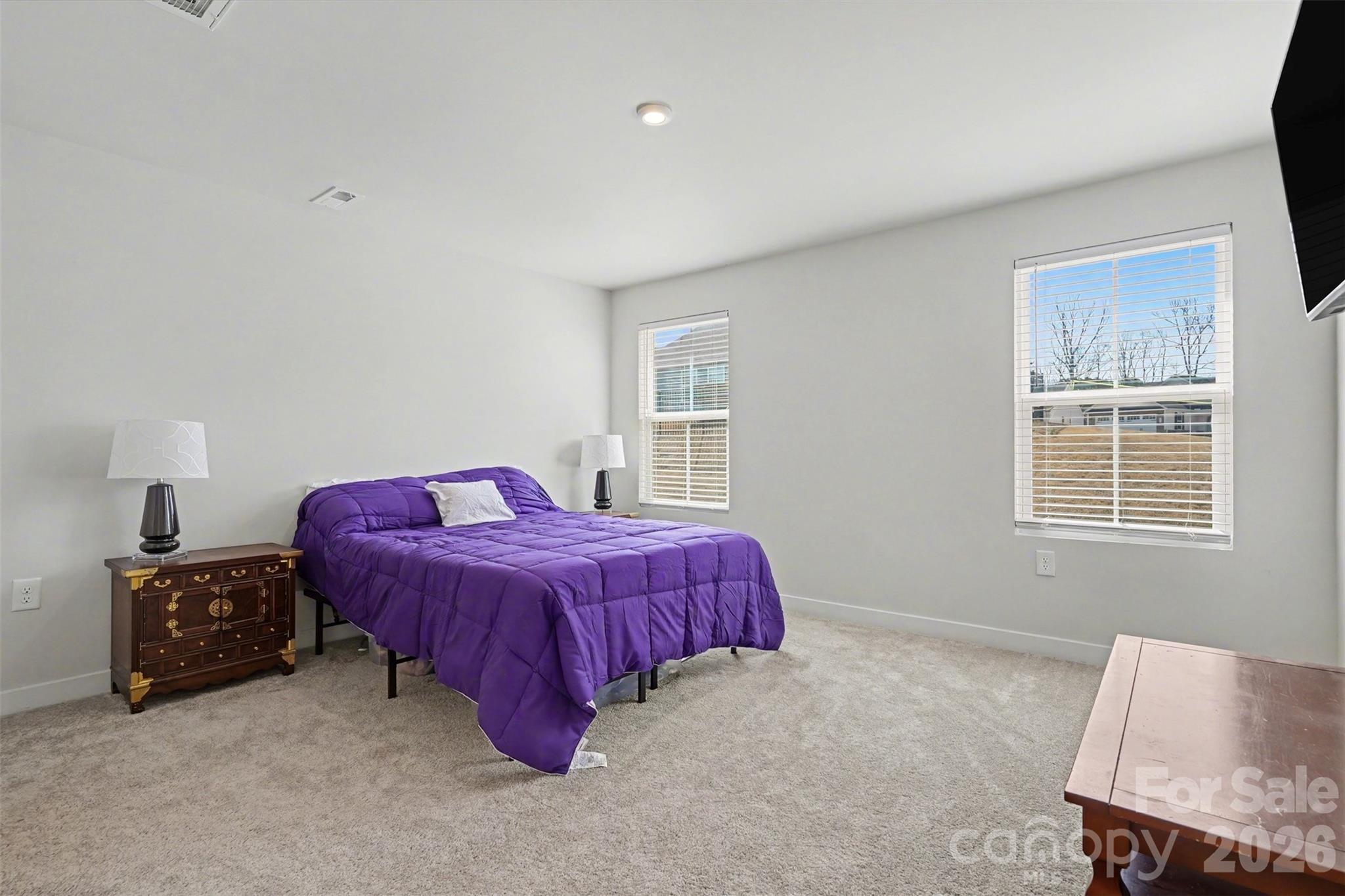 621 Grandiflora Avenue Lancaster, SC 29720 - Photo 18 of 37 a spacious bedroom with a bed and a window