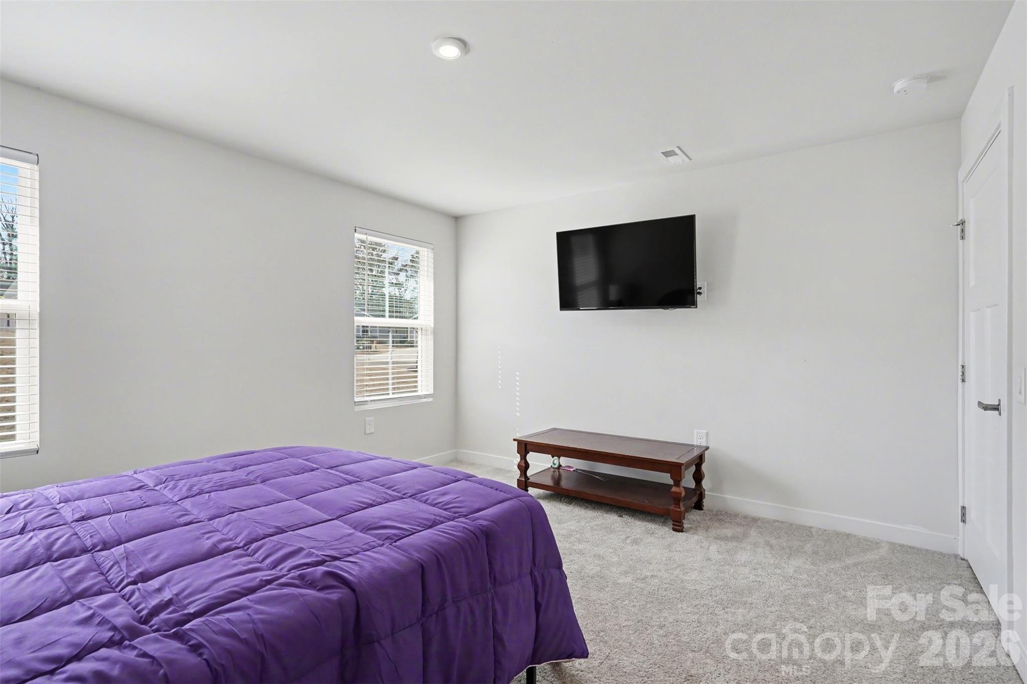 621 Grandiflora Avenue Lancaster, SC 29720 - Photo 19 of 37 a bedroom with a bed and a flat screen tv