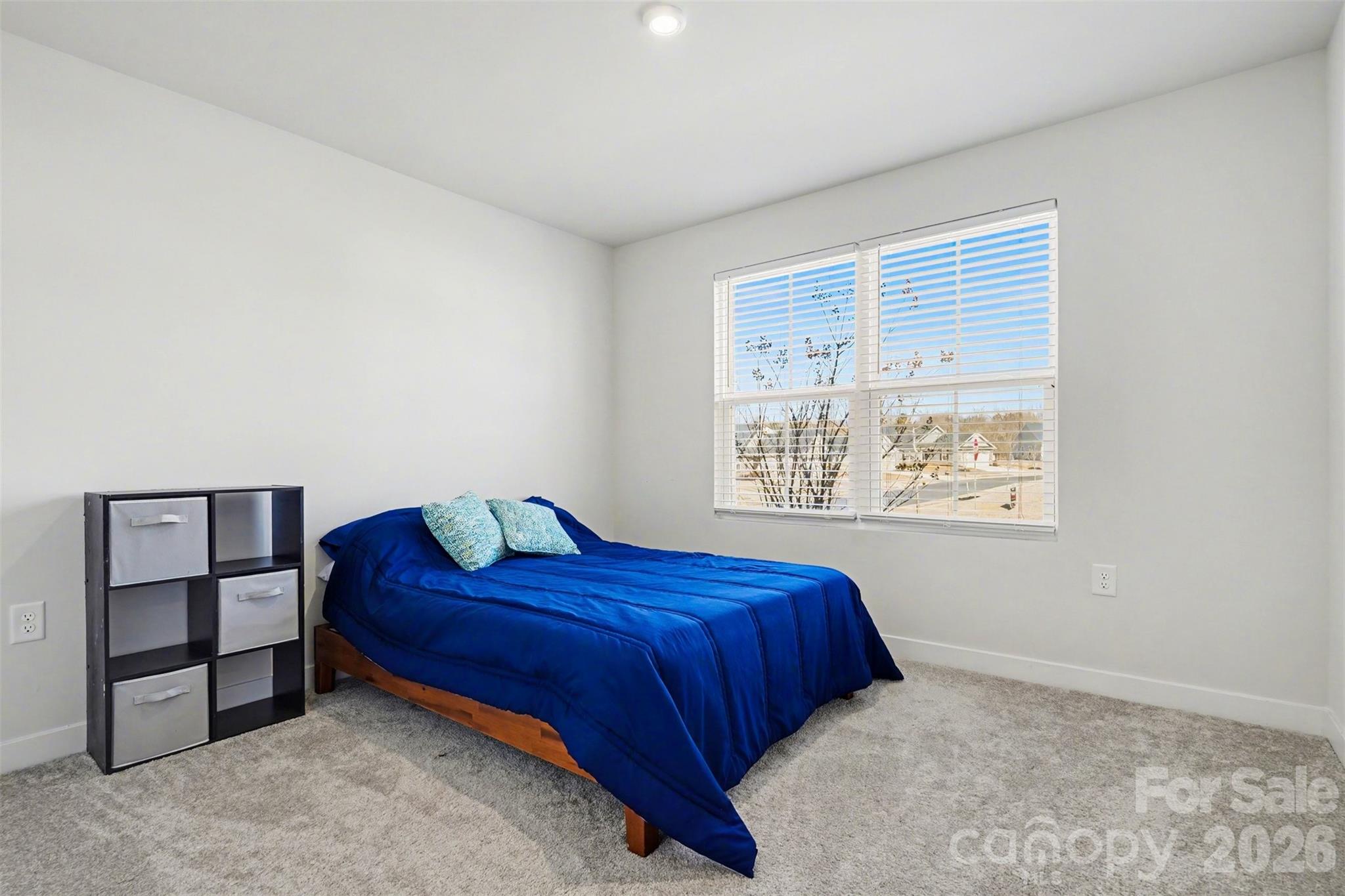 621 Grandiflora Avenue Lancaster, SC 29720 - Photo 23 of 37 a bedroom with a bed and a window