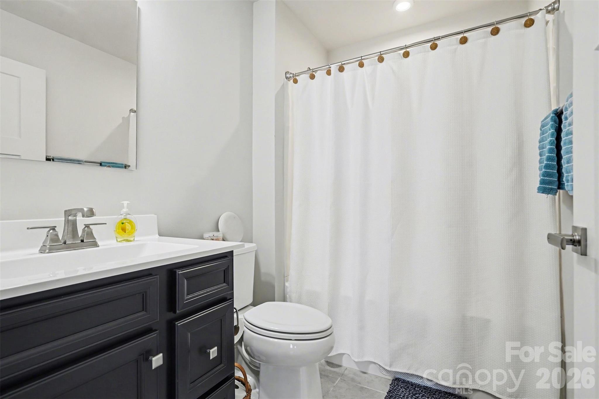 621 Grandiflora Avenue Lancaster, SC 29720 - Photo 25 of 37 a view of a bathroom with a sink and a toilet
