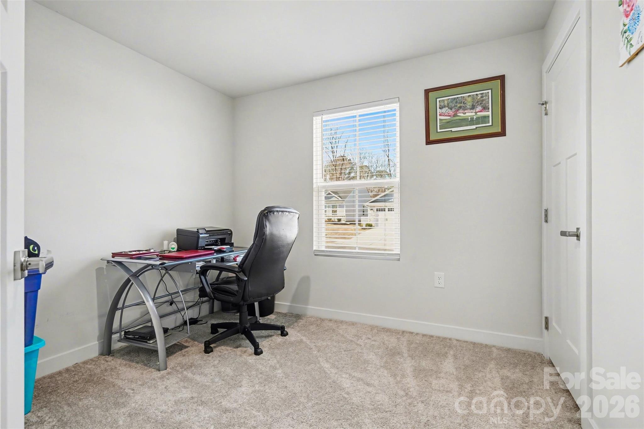 621 Grandiflora Avenue Lancaster, SC 29720 - Photo 26 of 37 a view of a workspace with furniture and a window