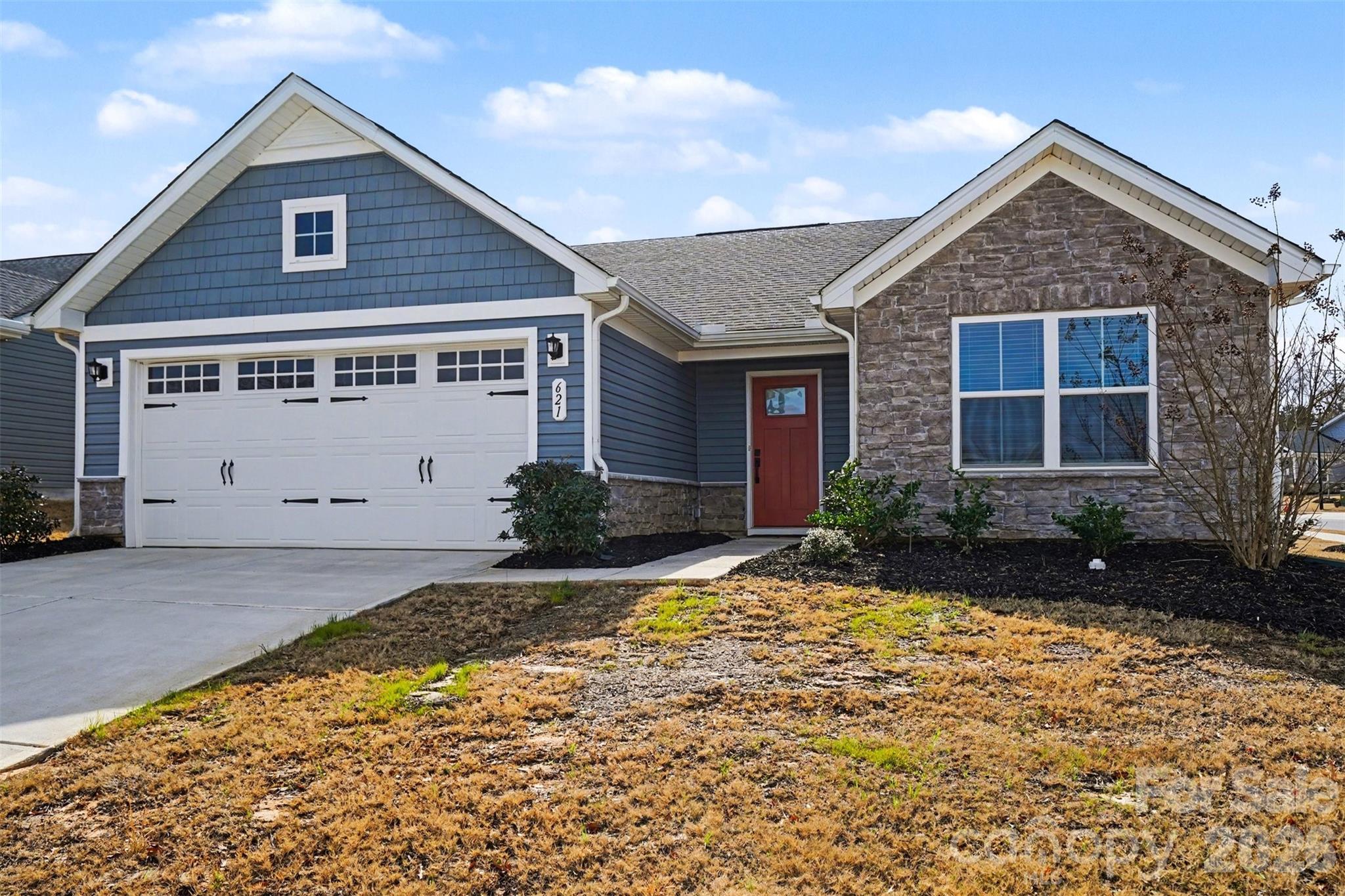 621 Grandiflora Avenue Lancaster, SC 29720 - Photo 3 of 37 a front view of a house with a yard