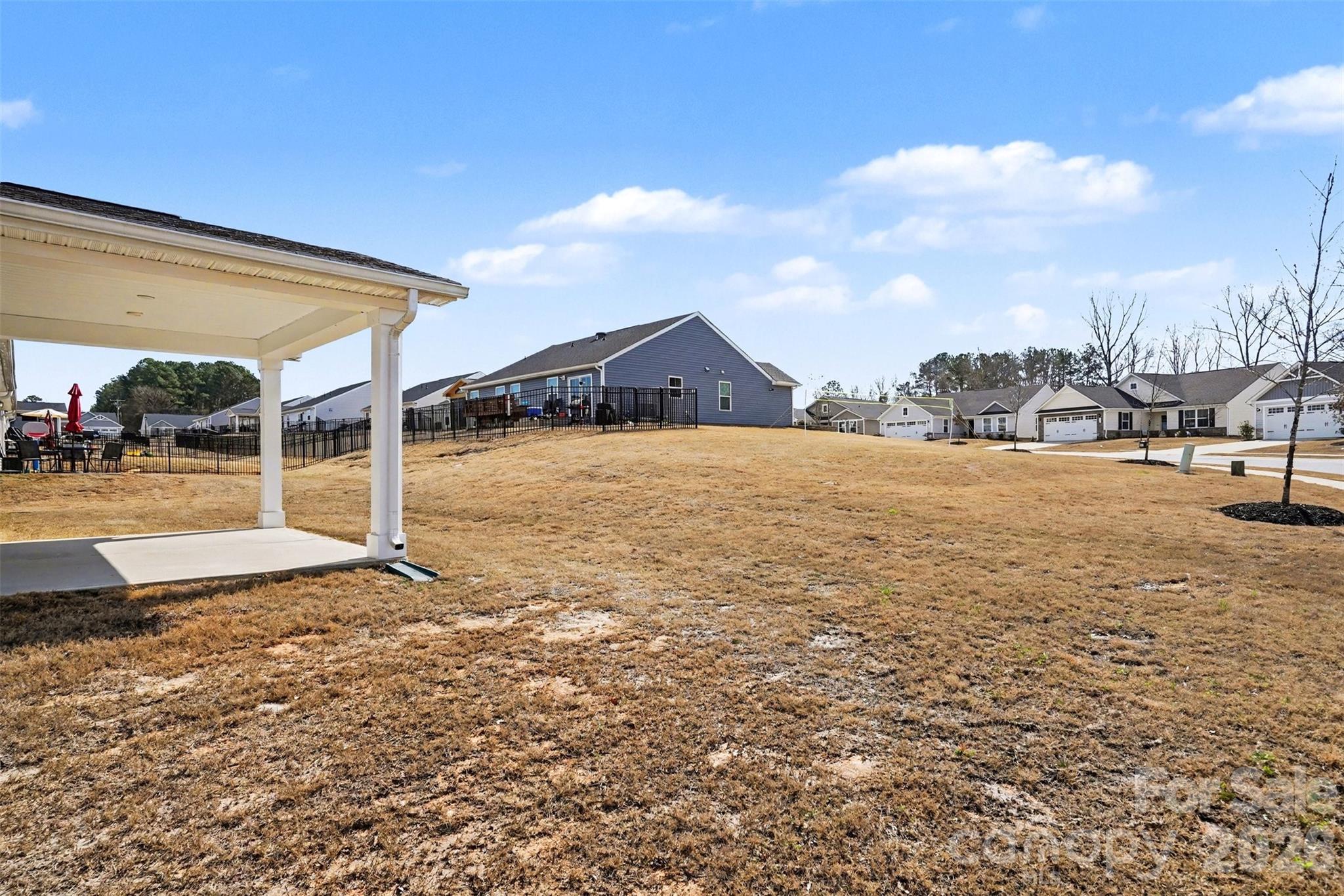 621 Grandiflora Avenue Lancaster, SC 29720 - Photo 34 of 37 a view of an house with backyard and bushes