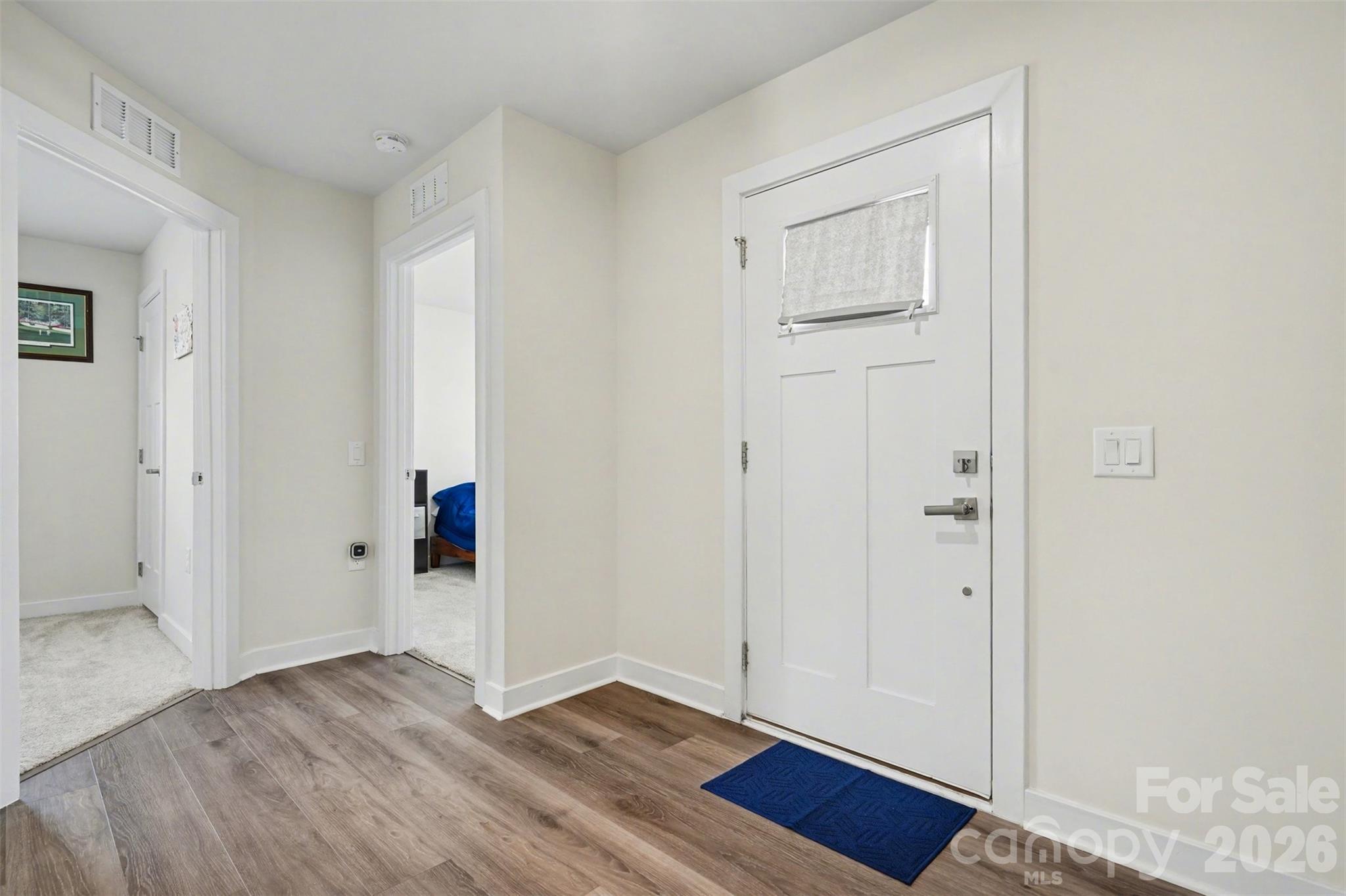621 Grandiflora Avenue Lancaster, SC 29720 - Photo 4 of 37 an empty room with wooden floor and closet