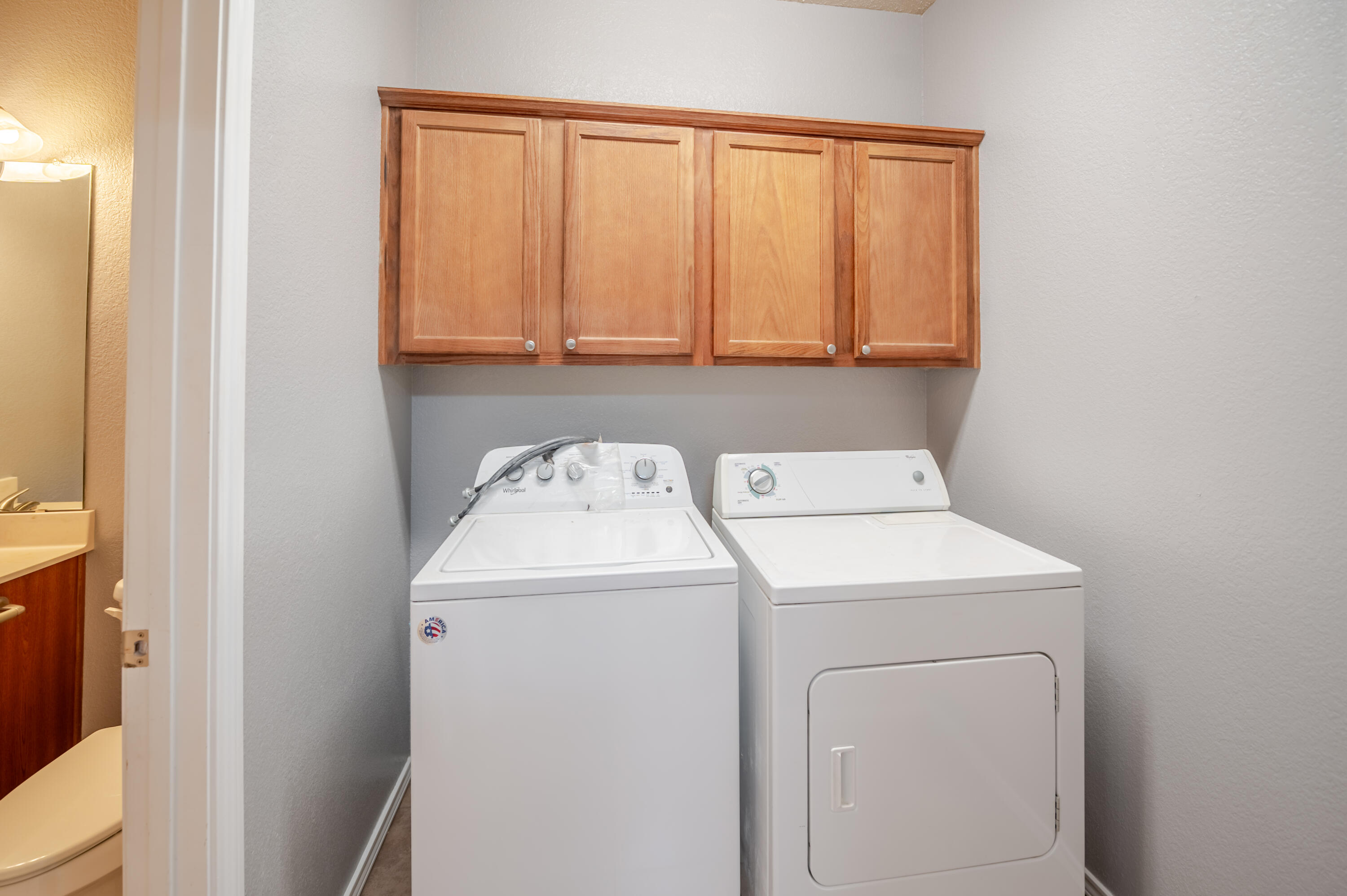 2111 Main Street, Unit 1 Lubbock, TX 79401 - Photo 17 of 36 a utility room with dryer and washer