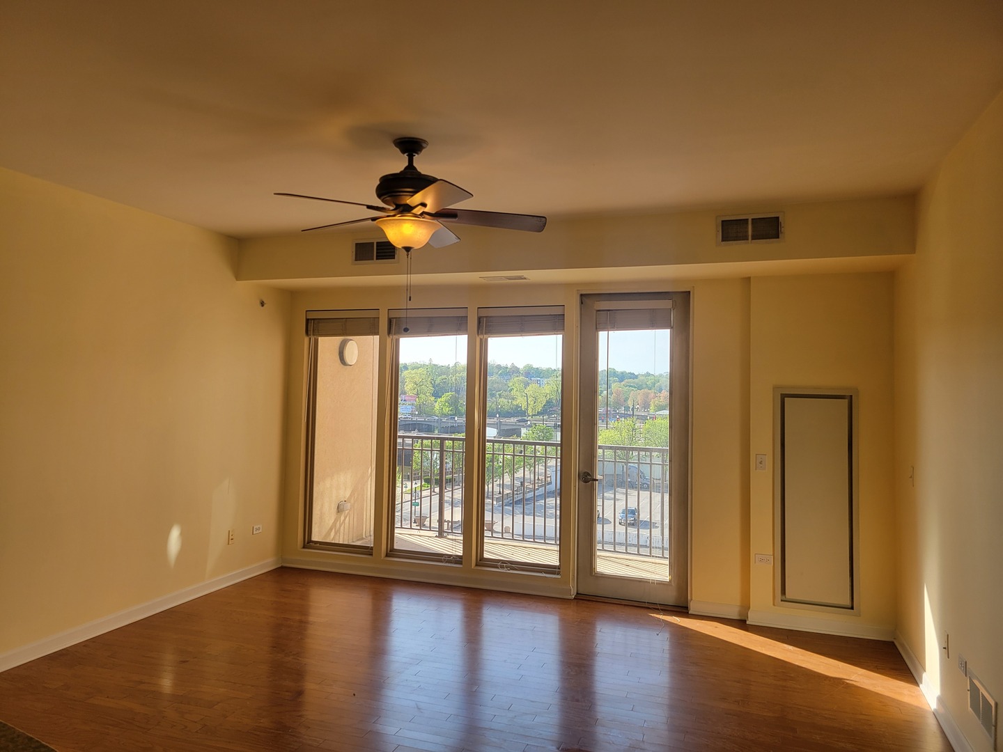50 South Grove Avenue, Unit 510 Elgin, IL 60120 - Photo 2 of 7 a view of empty room with wooden floor and fan