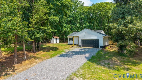865 Sulphur Spring Road Prospect, VA 23960 - Photo 4 of 40 White-sided residence featuring a dark-paneled gar