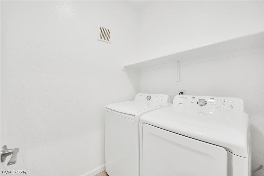 8725 West Flamingo Road, Unit 110 Las Vegas, NV 89147 - Photo 15 of 30 A well-organized laundry area offers a convenient space for chores with integrated shelving.