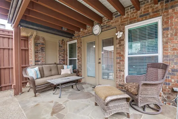 a outdoor living space with furniture and a large window