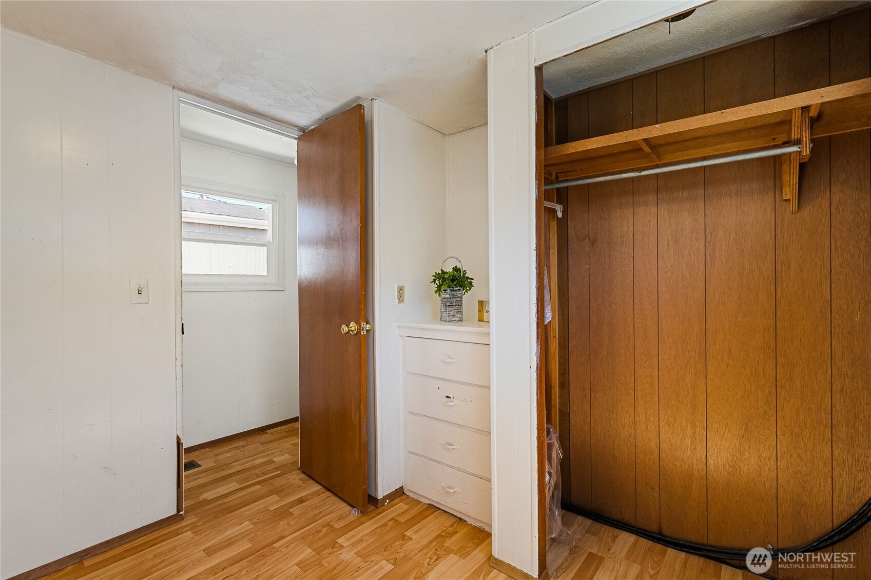 8080 Harborview Road, Unit 167 Blaine, WA 98230 - Photo 17 of 27 a view of walk in closet with wooden floor