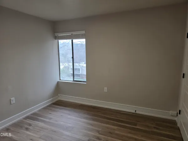 wooden floor and window in an empty room