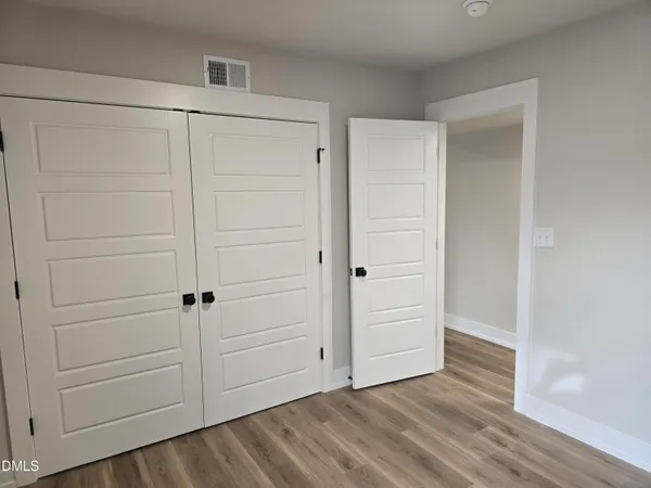 wooden floor area walk in closet