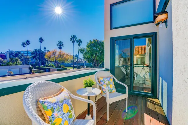 a view of swimming pool with outdoor seating and a potted plant