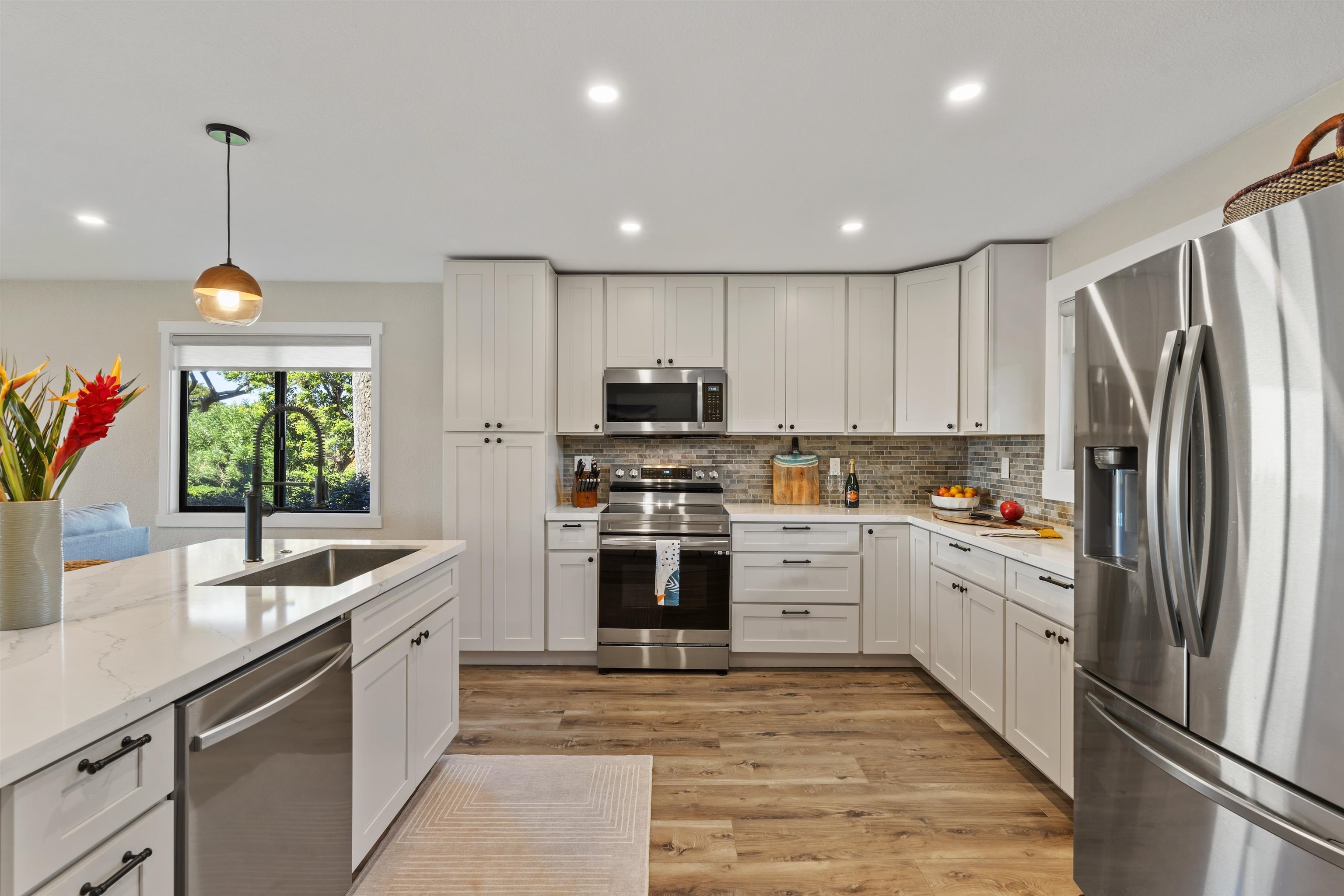 150 Puukolii Road, Unit 43 Lahaina, HI 96761 - Photo 11 of 31 a large kitchen with stainless steel appliances granite countertop a sink and a refrigerator