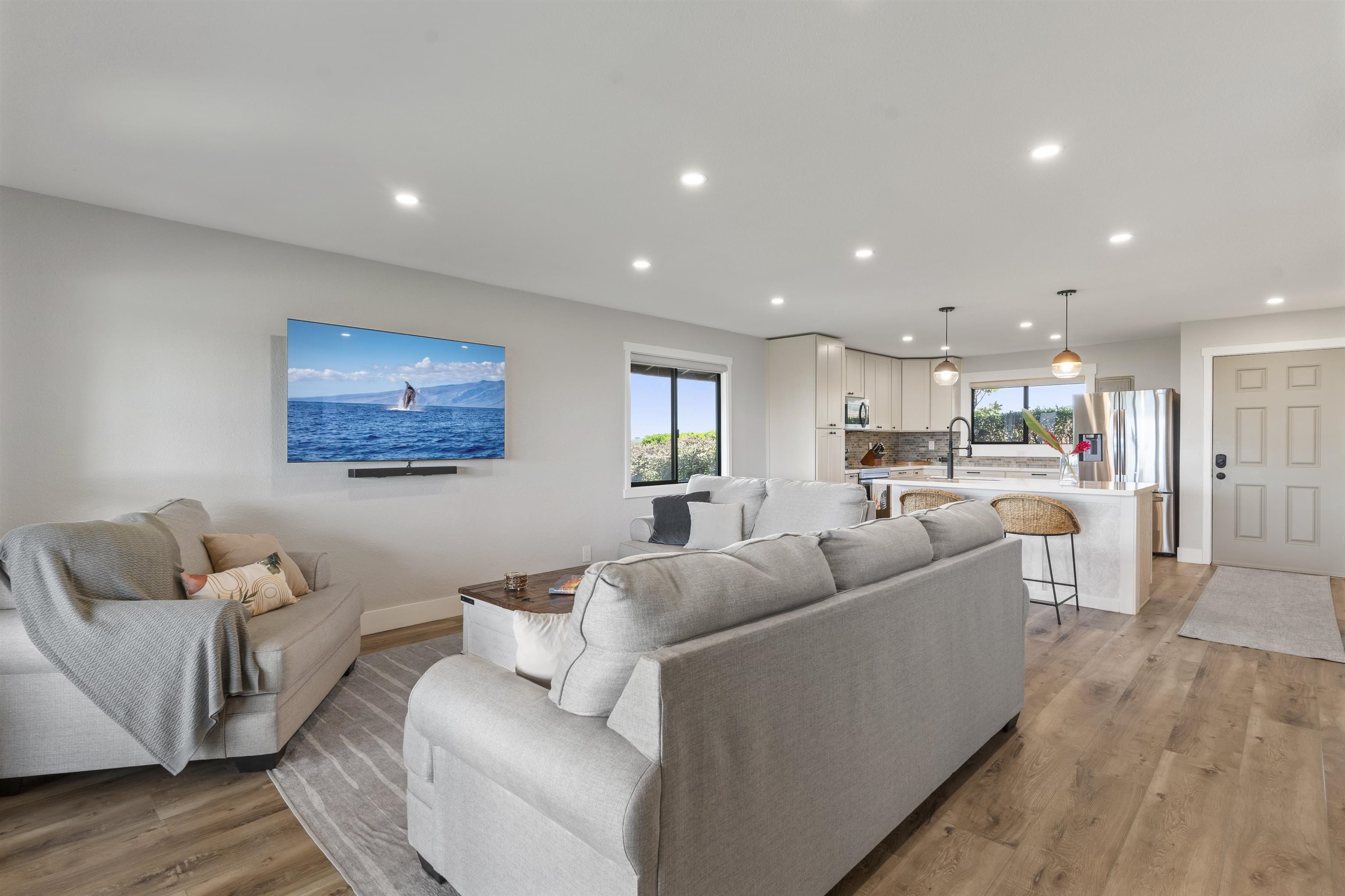 150 Puukolii Road, Unit 43 Lahaina, HI 96761 - Photo 15 of 31 a living room with furniture and a wooden floor