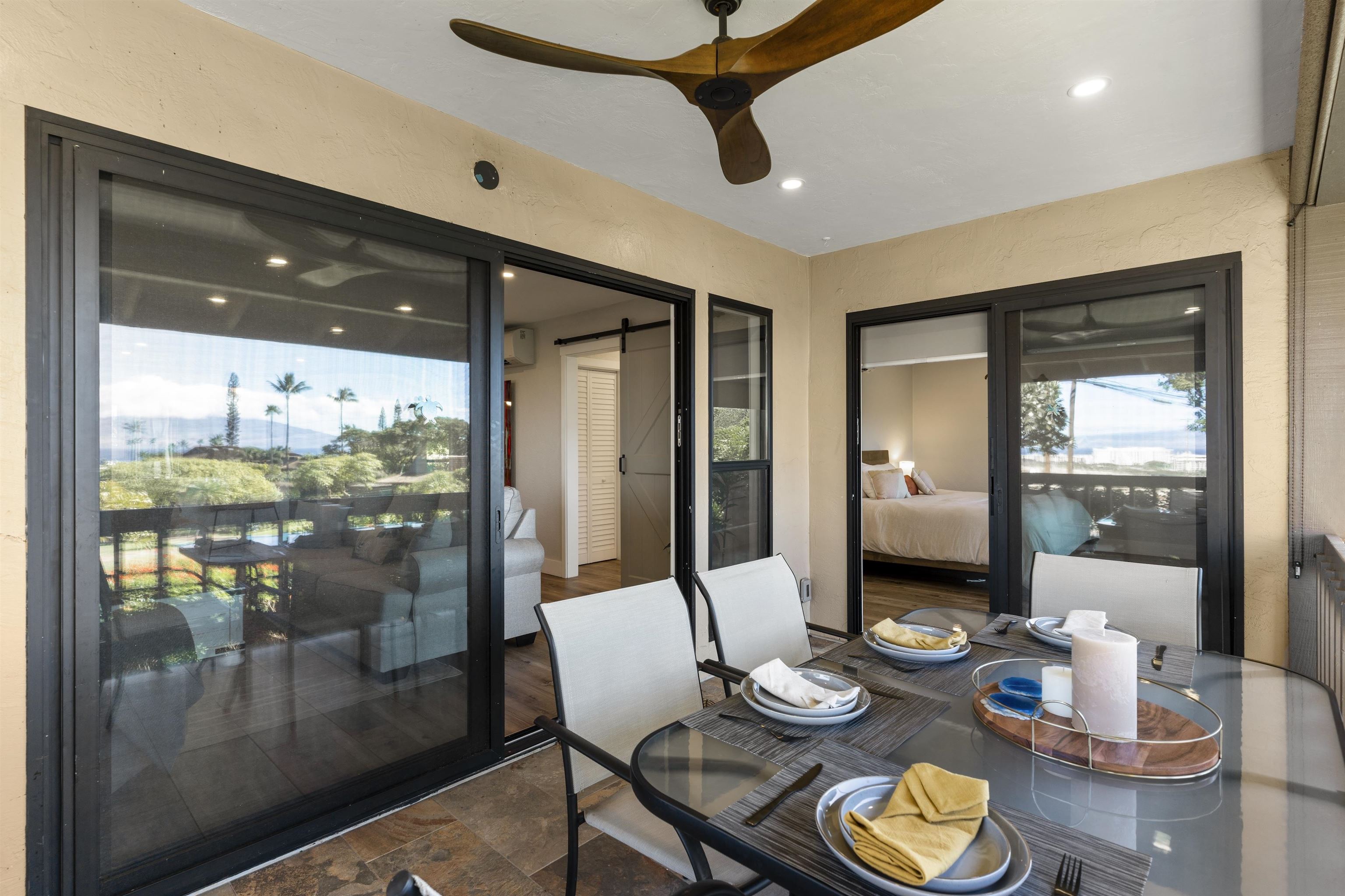 150 Puukolii Road, Unit 43 Lahaina, HI 96761 - Photo 19 of 31 a dining room with furniture a chandelier and window