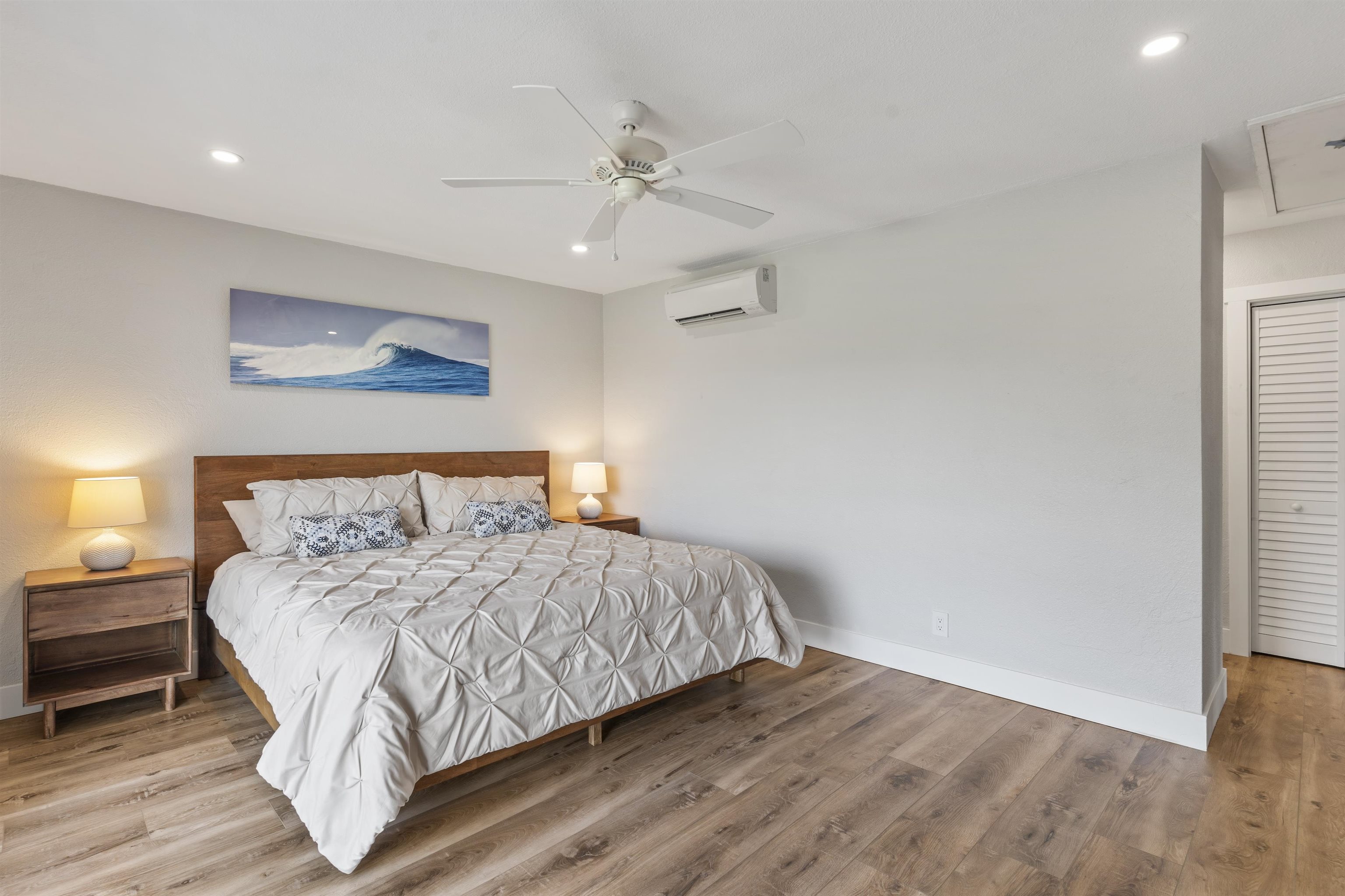 150 Puukolii Road, Unit 43 Lahaina, HI 96761 - Photo 20 of 31 a bedroom with a bed and a night stand