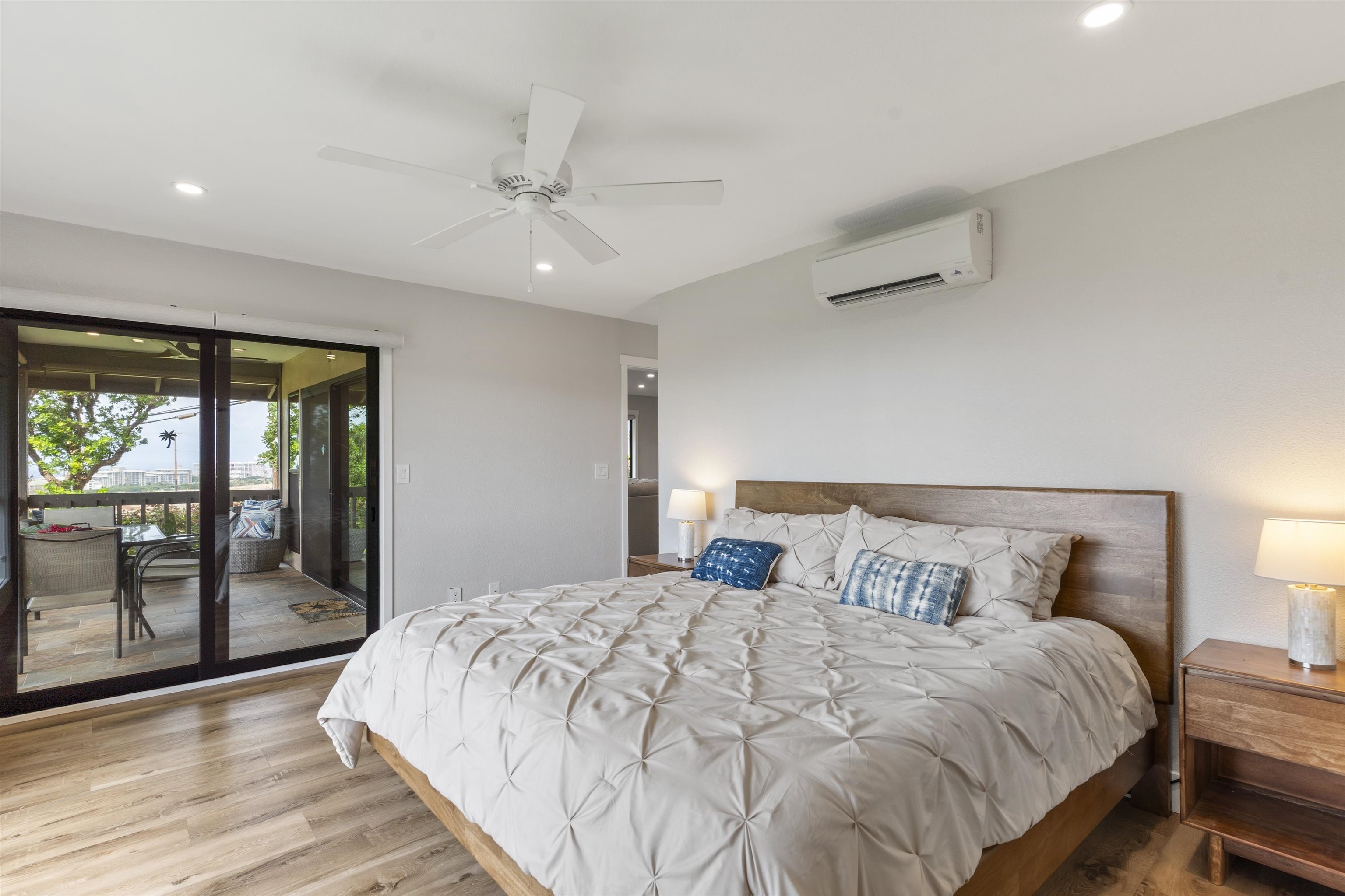 150 Puukolii Road, Unit 43 Lahaina, HI 96761 - Photo 24 of 31 a bedroom with a large bed and a large window