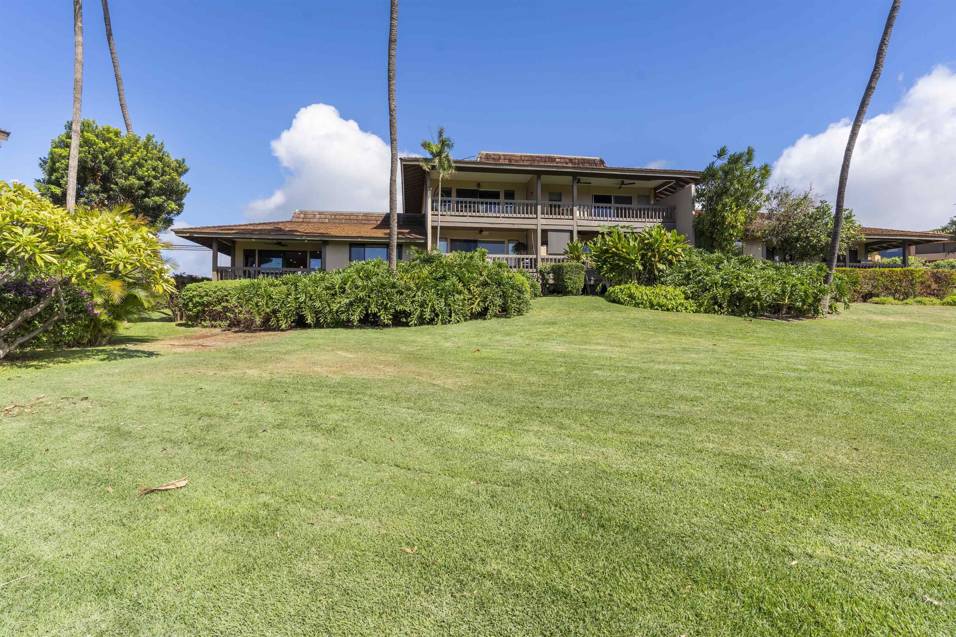 150 Puukolii Road, Unit 43 Lahaina, HI 96761 - Photo 27 of 31 a view of a patio with table and chairs potted plants