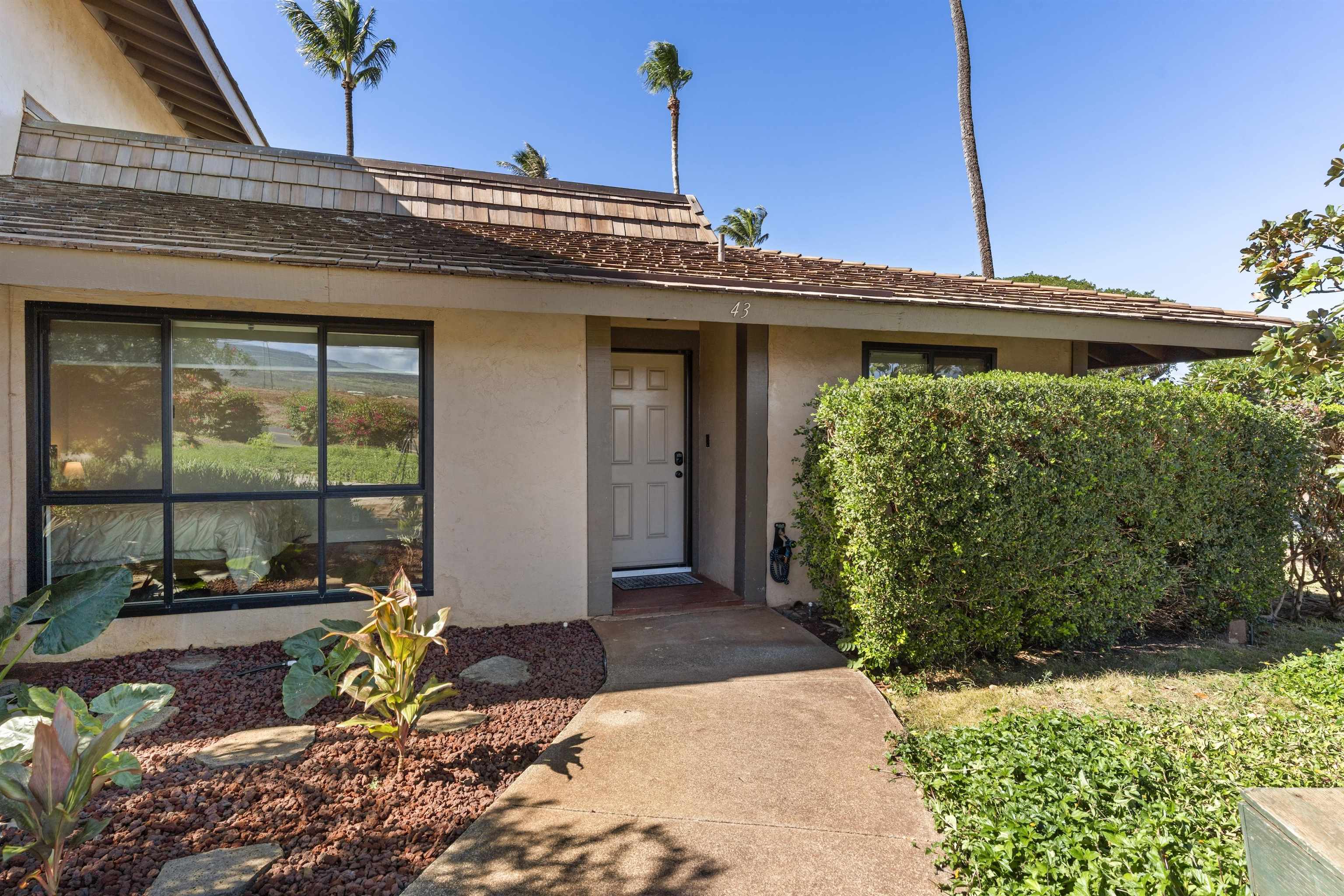 150 Puukolii Road, Unit 43 Lahaina, HI 96761 - Photo 10 of 31 a view of a house with large windows
