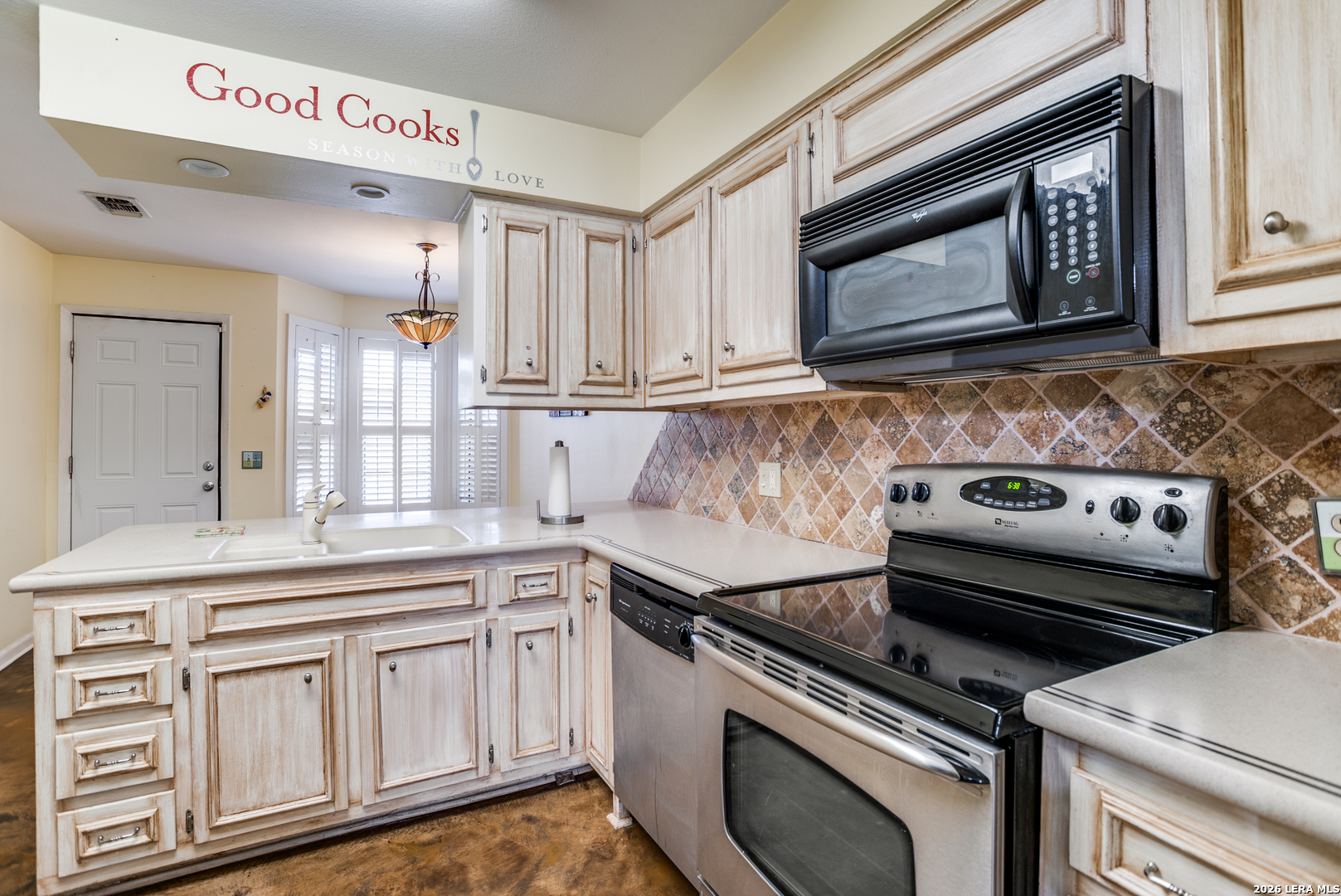 5359 Fredericksburg, Unit 515 San Antonio, TX 78229 - Photo 3 of 25 a kitchen with white cabinets and appliances