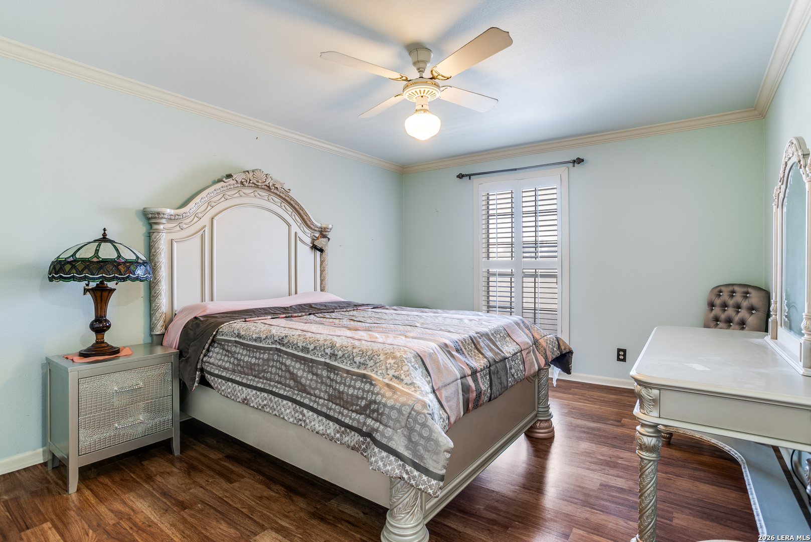 5359 Fredericksburg, Unit 515 San Antonio, TX 78229 - Photo 6 of 25 a bedroom with a bed and a chandelier