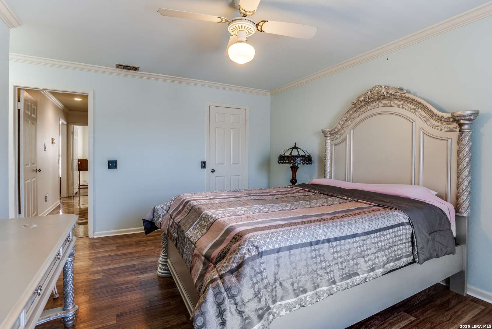 5359 Fredericksburg, Unit 515 San Antonio, TX 78229 - Photo 7 of 25 a bedroom with a bed and a chandelier