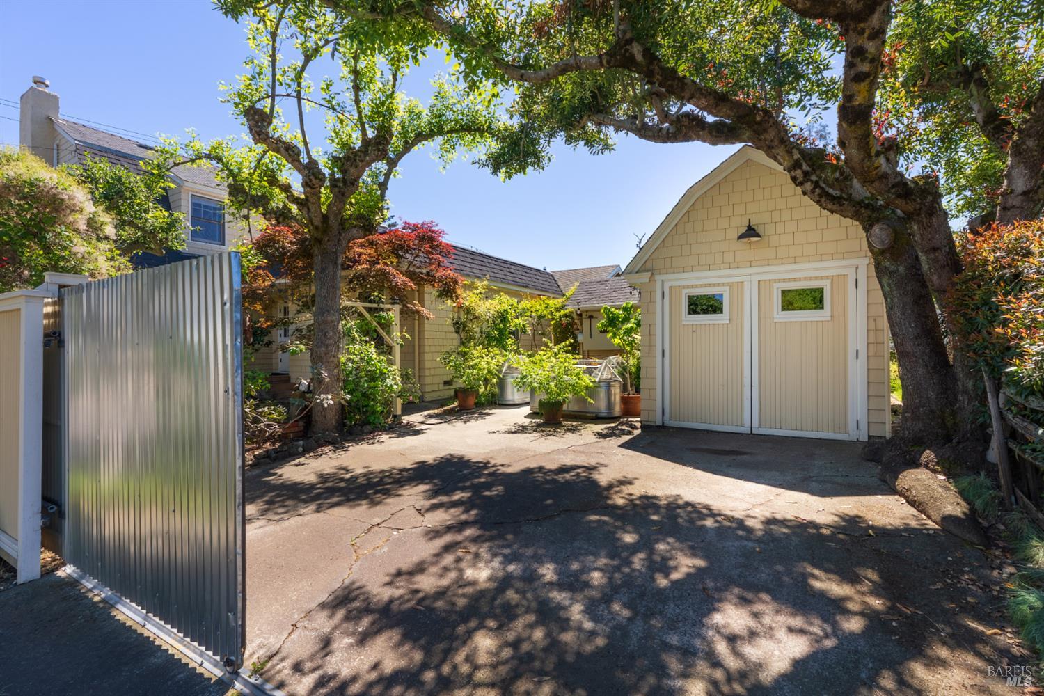 931 Humboldt Street Santa Rosa, CA 95404 - Photo 46 of 61 Rolling gate allows offers gated off street parking and garage access or can be kept closed to expand the yard.