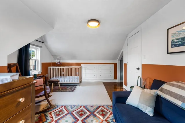 a bedroom with furniture and a window