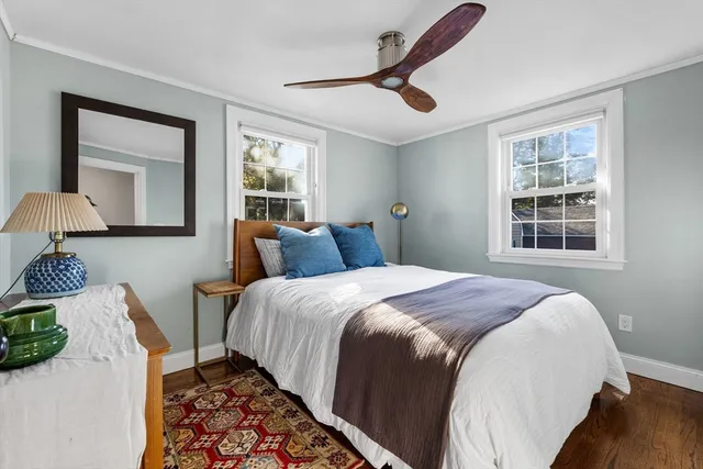 a bedroom with a large bed and a window