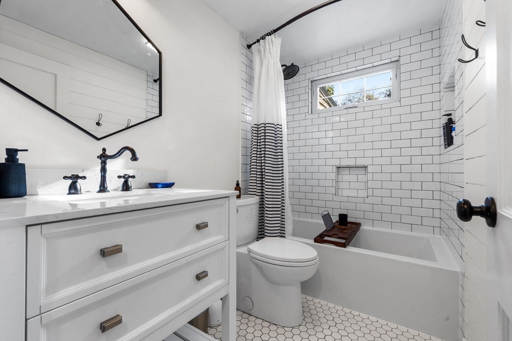 13 Parsons Drive Beverly, MA 01915 - Photo 20 of 31 a bathroom with a sink a toilet and shower