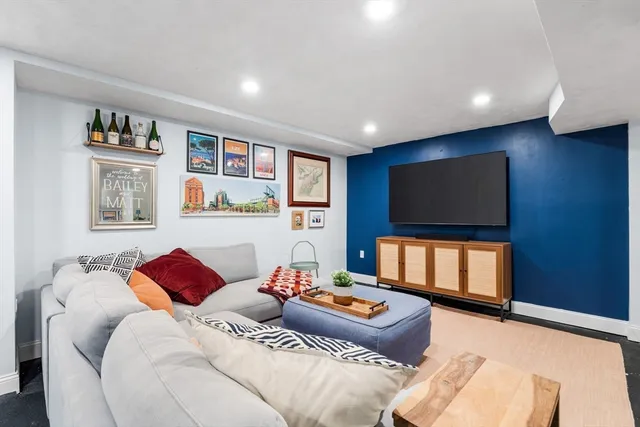 a living room with a couch and a flat screen tv