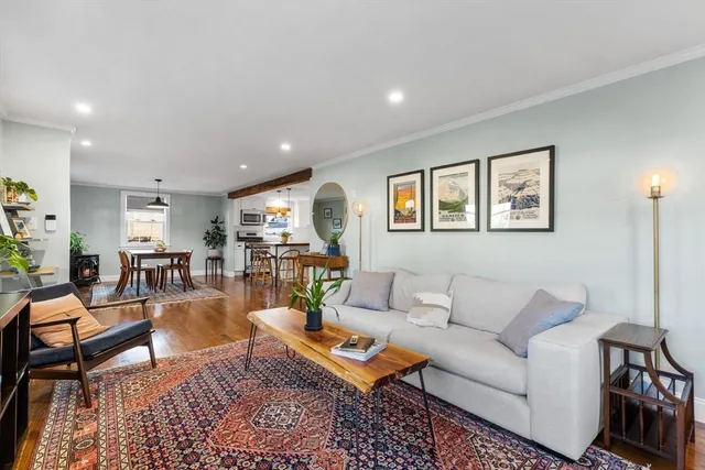 a living room with furniture and a table