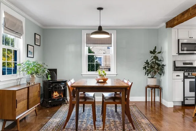 a dining room with furniture and window