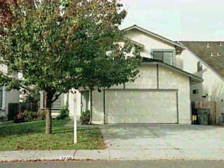 7449 Maximillian Place Rohnert Park, CA 94928 - Photo 1 of 1 a front view of a house with garden