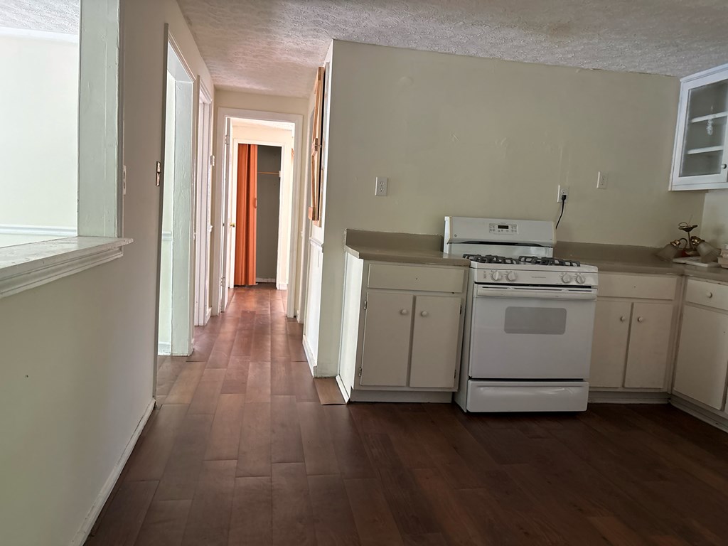 2910 Beech Street Columbus, GA 31909 - Photo 8 of 24 a view of a room with stove and wooden floor