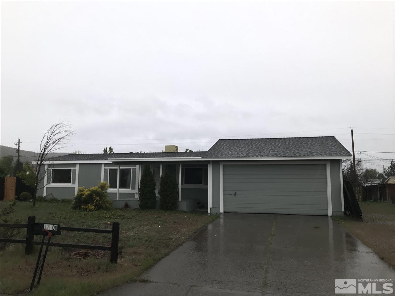 17400 Whippoorwill Lane Reno, NV 89508 - Photo 1 of 18 a front view of a house with a garage